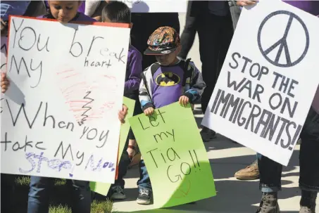  ?? Francisco Kjolseth / Salt Lake Tribune ?? Protesters rally for Silvia Juarez, a Mexican woman in Utah who was detained while shopping with her daughter last month.