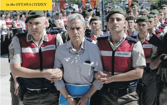  ?? BURHAN OZBILICI / THE ASSOCIATED PRESS ?? Paramilita­ry police and special force members escort Akin Ozturk, a former Turkish air force commander accused of terrorism and treason, outside a courthouse in Ankara. Ozturk is one of nearly 500 suspects, including a number of generals and military...