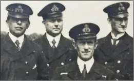  ??  ?? Survivor: Charles Lightoller, pictured front, with shipmates