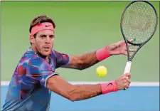  ?? ADAM HUNGER/AP PHOTO ?? Argentina’s Juan Martin del Potro returns shot during his dramatic five-set win over sixth-seeded Dominic Thiem of Austria during the fourth round of the U.S. Open on Monday in New York.