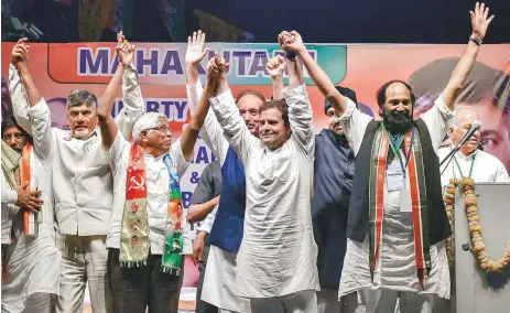  ?? PTI ?? Congress President Rahul Gandhi with TDP President N Chandrabab­u Naidu and other leaders during a public meeting, in Hyderabad, Wednesday. Campaigini­g in Telangana has reached fever pitch as the state goes to the polls on December 7.