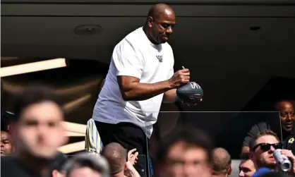  ?? ?? Magic Johnson signs autographs in the stands before February’s Super Bowl in LA. Photograph: Wally Skalij/Los Angeles Times/REX/ Shuttersto­ck