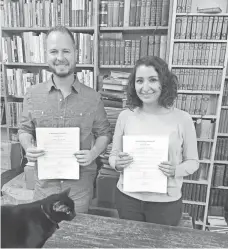  ?? CAPITOL HILL BOOKS ?? Kyle Burk, who works at Capitol Hill Books, and Selva Hernandez, owner of the Mexico City bookstore, signed a mostly symbolic agreement between their businesses.