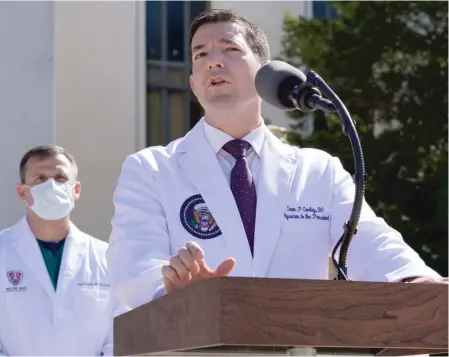  ?? AP ?? Dr. Sean Conley, physician to President Donald Trump, briefs reporters Saturday at Walter Reed National Military Medical Center.