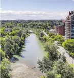  ??  ?? A view of the Elbow River from The River luxury condos, which are situated on the north bank of the Elbow.