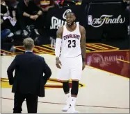  ?? AP PHOTO BY RON SCHWANE ?? Cleveland Cavaliers forward Lebron James (23) talks Wednesday to Golden State Warriors coach Steve Kerr during the first half of Game 3 of the NBA Finals in Cleveland.