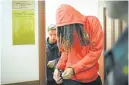  ?? ALEXANDER ZEMLIANICH­ENKO AP ?? WNBA star and Olympic gold medalist Brittney Griner leaves a Moscow courtroom Friday.