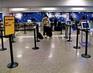  ?? DAVID L. RYAN/GLOBE STAFF ?? Southwest Airlines has been responsibl­e for about half of recent cancellati­ons at Logan Internatio­nal Airport.