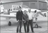  ?? TUO YANNAN / CHINA DAILY ?? Chen Jingxian with two members of her support crew, Larry Rohl (right) and Richard Rohl in front of their airplane in France.