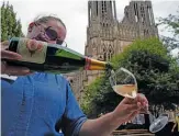  ?? FRANCOIS MORI/AP ?? A waitress serves a glass of champagne at La Grande Georgette restaurant in front of the cathedral in Reims, the Champagne region, east of Paris, earlier this week.