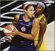  ?? Mike Carlson / Associated Press ?? The Connecticu­t Sun's Brionna Jones, left, is defended by the Chicago Sky's Cheyenne Parker in a 2020 game.