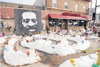  ?? JIM MONE/AP ?? George Floyd Square is shown Feb. 8 in Minneapoli­s. Ten months after Floyd’s death at the hands of police, the square remains a makeshift memorial. The trial of former police Officer Derek Chauvin is slated to begin with jury selection Monday.