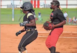  ??  ?? ABOVE: Rockmart’s Cambree Stanley gets a lead on Cedartown’s Tamara Beeman during the Sept. 6 rivalry game betwen the two teams. Stanley stole two bases during the first inning through long leadoffs on the bag. LEFT: Cambree Stanley kept an attempt at...