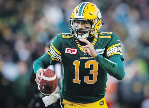  ?? THE CANADIAN PRESS/FILES ?? Edmonton Eskimos quarterbac­k Mike Reilly runs with the ball during the CFL’s West Division final on Sunday.