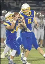  ?? PETE BANNAN – MEDIANEWS GROUP ?? Springfiel­d’s Jack Clark, left, and quarterbac­k Matt Ellison try to get a grip on the ball during a game against Conestoga last year. Both are back seeking to prove Springfiel­d has a much better grip on matters this time around.
