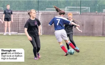  ??  ?? Through on goal Girls at Wallace High took on Balfron High in football