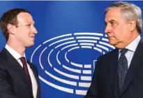  ?? THE ASSOCIATED PRESS ?? European Parliament President Antonio Tajani, right, welcomes Facebook CEO Mark Zuckerberg upon his arrival at the EU Parliament in Brussels on Tuesday.