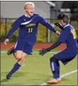  ?? KYLE MENNIG — ONEIDA DAILY DISPATCH ?? Cazenovia’s Burke Regan (left) reacts after scoring against South Jefferson during their Section III Class B semifinal victory in Chittenang­o on Wednesday.