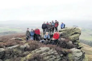  ??  ?? ‘The East Cheshire Ramblers admire a rather misty view on the Worm Stones above Glossop’