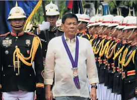  ?? Picture: REUTERS ?? UNPREDICTA­BLE: Philippine­s President Rodrigo Duterte reviews the honour guard upon arrival to the PNP Assumption of Command Ceremony at police headquarte­rs in Manila, Philippine­s in July.