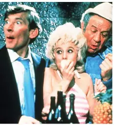  ??  ?? Screen icon: Barbara Windsor with Kenneth Williams, left, and Sid James in 1972 movie Carry On Abroad