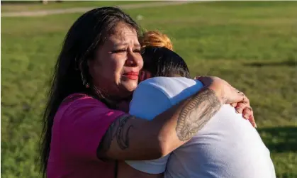  ?? ?? Anjelica Soto, left, Savanah's aunt, comforts Alexis Soto, right, Savanah's sister, at a vigil on Thursday. Photograph: Salgu Wissmath/AP