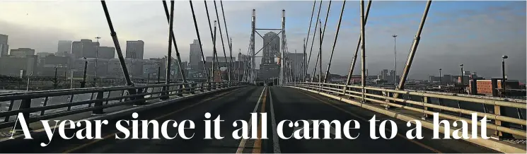  ?? Picture: Alon Skuy ?? Nelson Mandela Bridge in Braamfonte­in, Johannesbu­rg, a route normally choked with traffic but eerily empty at the beginning of the lockdown last year. It would remain so until SA slowly came back to life in a new normal in the age of the pandemic.