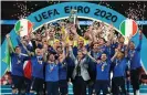  ?? ?? Giorgio Chiellini lifts the Euro 2020 trophy. Photograph: Michael Regan/AFP/ Getty Images