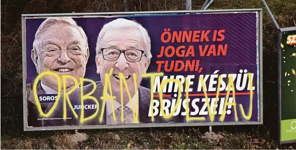  ?? Foto: ČTK ?? Pozor na ně! Máte také právo vědět, co Brusel chystá, varoval v ulicích Budapešti maďarské voliče předvolebn­í billboard s portréty šéfa Evropské komise Junckera a amerického miliardáře Sorose. Přes to někdo nastříkal hanlivý nápis „Orbán je zloděj“.