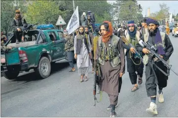  ?? AFP ?? Taliban fighters take out a rally celebratin­g the US withdrawal of troops, in Kabul on Tuesday.