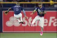  ?? CHRIS O’MEARA - THE ASSOCIATED PRESS ?? Tampa Bay Rays shortstop Wander Franco (5) celebrates with center fielder Jose Siri after defeating the Milwaukee Brewers on Saturday.