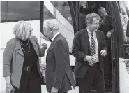  ?? THE ASSOCIATED PRESS ?? Sen. Claire McCaskill, D-Mo., left, talks with Sen. Bob Corker, R-Tenn., as Sen. Sherrod Brown, D-Ohio, second from right, and Sen. Bob Menendez, D-N.J., right, return to Capitol Hill after Wednesday’s briefing at the White House on North Korea.