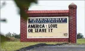  ?? WSET-TV VIA AP ?? This Tuesday image from video provided by WSET-TV shows a sign for the Friendship Baptist Church which reads, “America: Love it or Leave It” in Appomattox, Va. Amid a national furor over President Donald Trump’s tweet urging four Democratic congresswo­men to “go back” to their home countries, Pastor E. W. Lucas is gaining attention with the sign at his church.