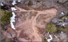  ?? PROVIDED BY MIKE BORUTA ?? An aerial view of the West Gold Hill Dinosaur Tracksite in Ouray. The site features 134consecu­tive steps left by a sauropod 150 million years ago, making it one of the longest continuous trackways in the world. It’s also unique because the dinosaur makes a more than 180-degree turn.