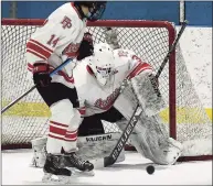  ?? Erik Trautmann / Hearst Connecticu­t Media ?? Fairfield Prep goalie Thomas Martin stops a shot during the Jesuits’ 4- 2 victory over No. 1 Notre Dame- West Haven on Saturday in Bridgeport.