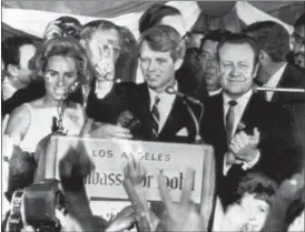  ?? THE ASSOCIATED PRESS FILE ?? U.S. Sen. Robert F. Kennedy, D-NY, speaks to campaign workers as his wife Ethel, left, and California campaign manager and speaker of the California Assembly, Jesse Unruh, look on, at the Ambassador Hotel in Los Angeles. After making a short speech,...
