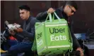  ??  ?? Uber Eats workers wait for orders in central Kiev, Ukraine. Is delivering takeouts the way forward for the company? Photograph: Valentyn Ogirenko/Reuters