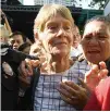  ??  ?? AUSTRALIAN nun Patricia Fox is escorted by immigratio­n officers upon her release Monday.