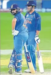  ?? AP ?? ■ It remains to be seen if Rohit Sharma (left) sends MS Dhoni to bat at No 4 again on Sunday.