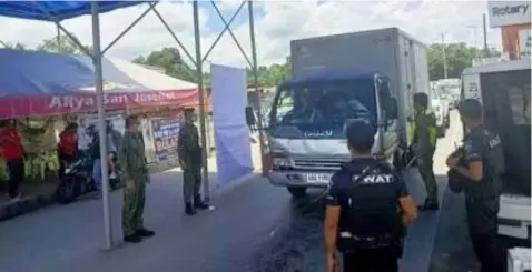  ?? BORDER POLICE. (Bulacan Police Provincial Office) ?? Police implement stricter border control points in the City of San Jose Del Monte, Bulacan as the province is placed under Modified Enhanced Community Quarantine (MECQ) until Aug. 31, 2021. At least 578 police personnel and force multiplier­s were deployed to implement stricter border control points in the province.