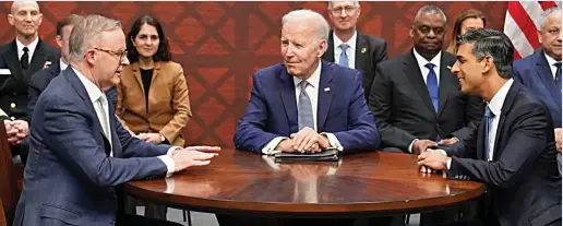  ?? ?? Round-table talks: Rishi Sunak with, left, Anthony Albanese and Joe Biden at the Point Loma US naval base yesterday