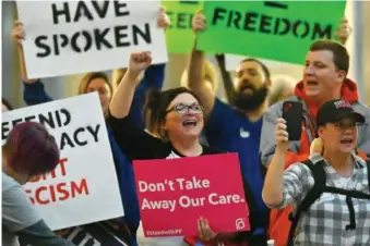  ?? AP PHOTO/TIMOTHY D. EASLEY ?? Protesters outside the Kentucky Supreme Court chambers in 2022 rally in favor of abortion rights as the Kentucky Supreme Court hears arguments whether to temporaril­y pause the state’s abortion ban in Frankfort, Ky.