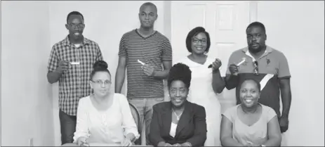  ??  ?? Four of the lucky residents (standing) along with Public Relations Officer (PRO), Iva Wharton [seated right], Minister Valerie Adams Patterson-Yearwood [seated centre] Housing Officer, Letisha Drakes. (DPI photo)