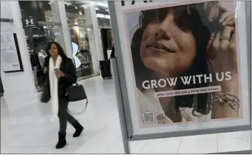  ?? SPENCER PLATT — GETTY IMAGES ?? A hiring sign is displayed outside of a store in New York City last month.