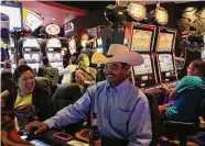  ?? Staff file photo ?? Jesus Tovar, of El Indio, plays a game with his wife, Sandra, at the Kickapoo Lucky Eagle Casino in 2014.