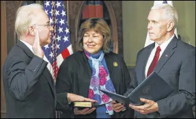  ?? MARK WILSON / GETTY IMAGES ?? Vice President Mike Pence (right) swears in Rep. Tom Price, R-Georgia, as secretary of health and human services as his wife, Betty Price, holds a Bible on Friday in Washington, D.C.