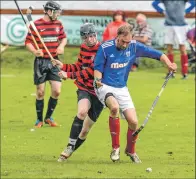  ?? Photo: Paul Paterson ?? CLASH OF THE ASH: Action from the South Division One game between Kyles Athletic and Lochside Rovers played at Tighnabrua­ich last Saturday. The Oban side ran out 5-3
winners