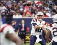  ?? Bob Levey / Getty Images ?? Texans quarterbac­k Mac Jones (10) makes a pass against the Texans on Sunday.