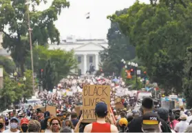  ?? Jacquelyn Martin / Associated Press ?? Demonstrat­ors rally near the White House in Washington in honor of George Floyd, a black man who died while shackled in police custody in Minneapoli­s.