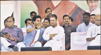  ?? HT PHOTO ?? Congress president Rahul Gandhi with Madhya Pradesh campaign committee head Jyotiradit­ya Scindia during a public meeting in Jaura in Morena district on Tuesday.